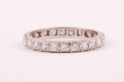 Lot 14 - A diamond eternity ring; the mixed round...