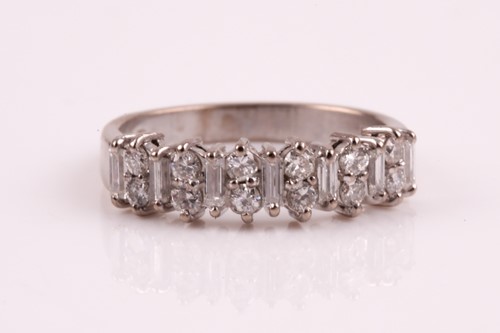 Lot 187 - A diamond half hoop eternity ring, set with...