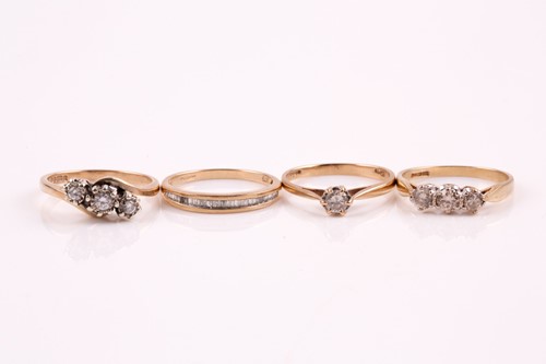 Lot 2 - A three stone diamond half hoop ring, the...