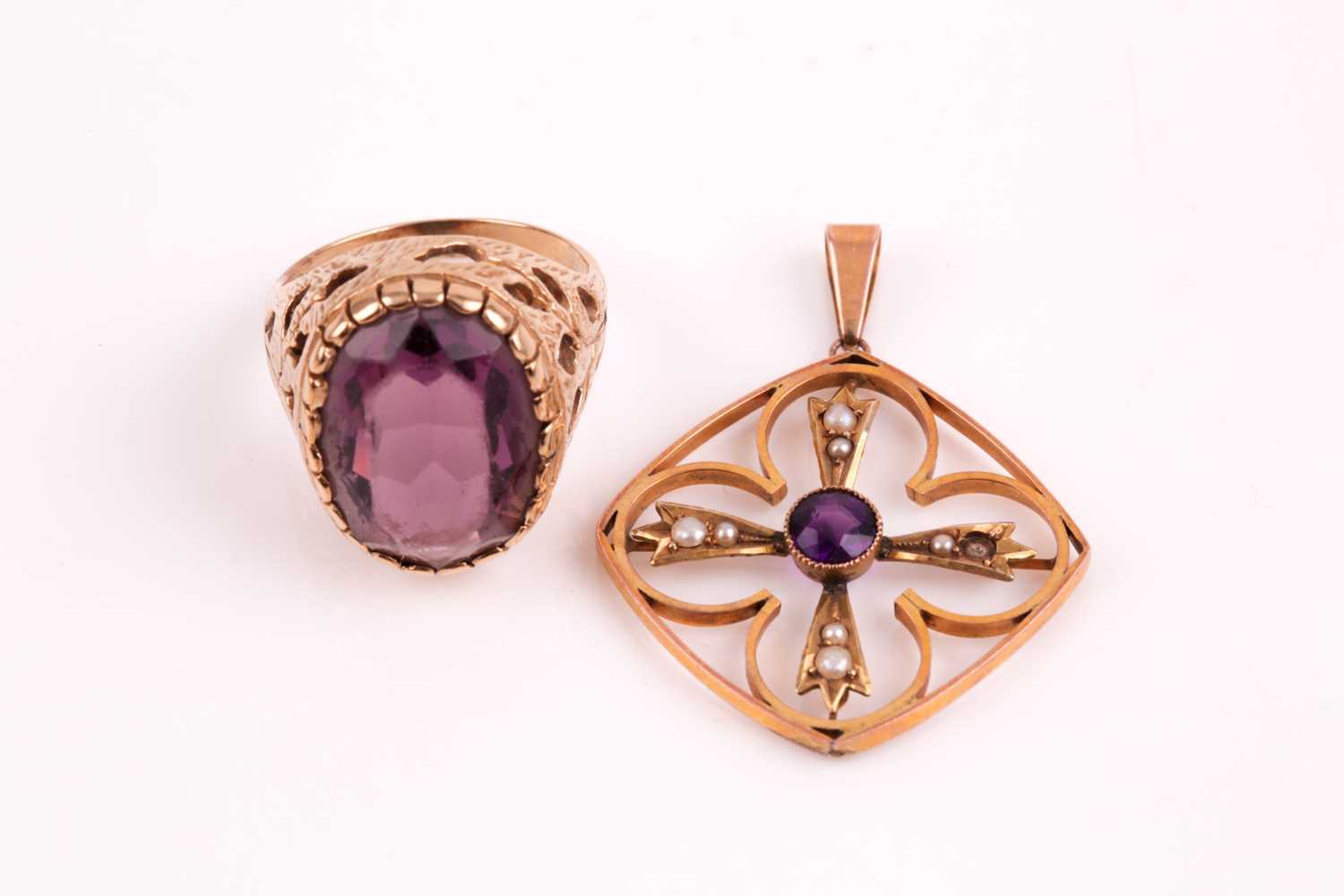 Lot 53 - An Edwardian amethyst and split pearl pendant,...
