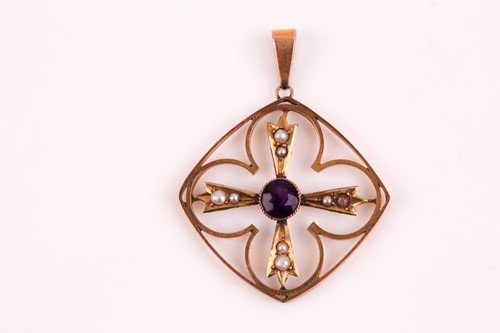 Lot 53 - An Edwardian amethyst and split pearl pendant,...