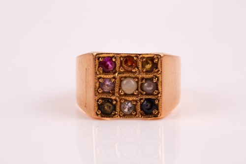 Lot 217 - A multi gem set ring, the square cluster pave...
