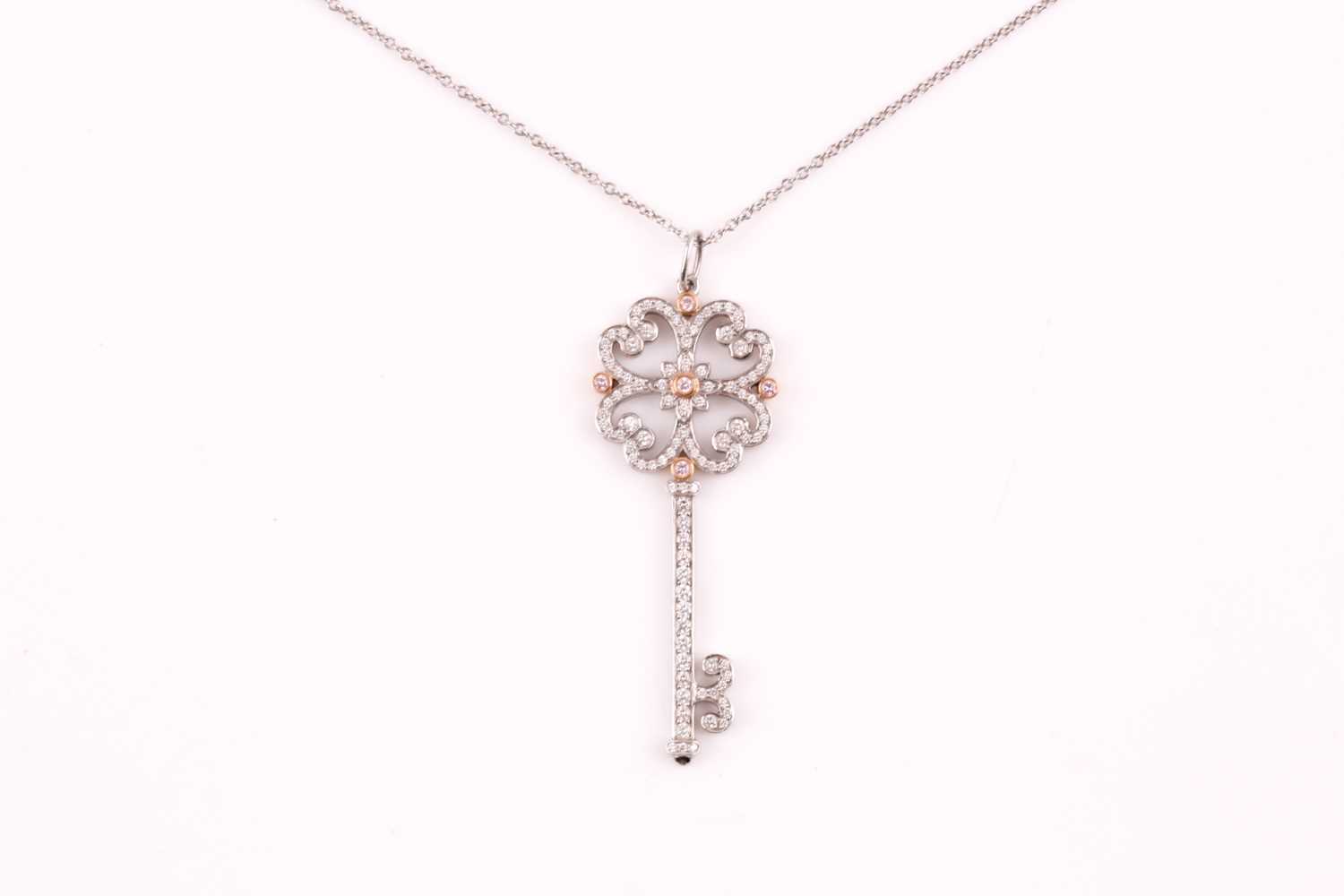 Lot 231 - A Tiffany enchanted key pendant; the diamond...