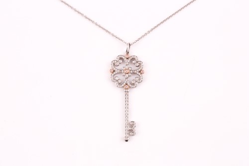 Lot 231 - A Tiffany enchanted key pendant; the diamond...