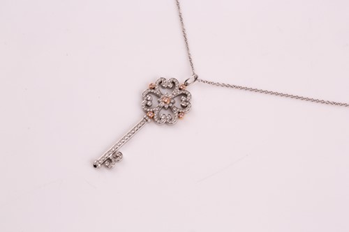 Lot 231 - A Tiffany enchanted key pendant; the diamond...