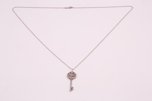 Lot 231 - A Tiffany enchanted key pendant; the diamond...