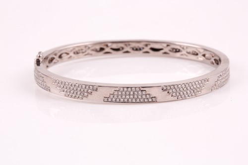 Lot 197 - An 18ct white gold and diamond bracelet; the...