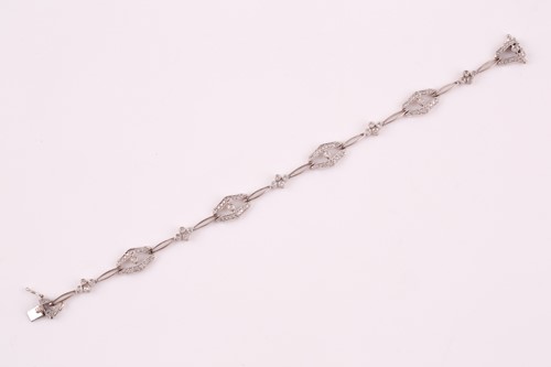 Lot 37 - A diamond bracelet; of alternating diamond set...