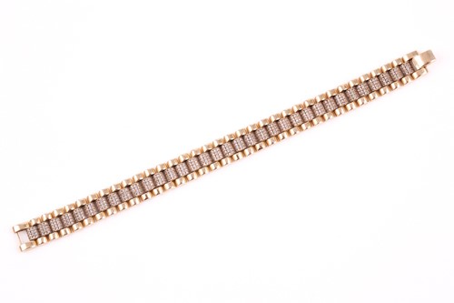 Lot 299 - A diamond bracelet, three rows of fluted links,...