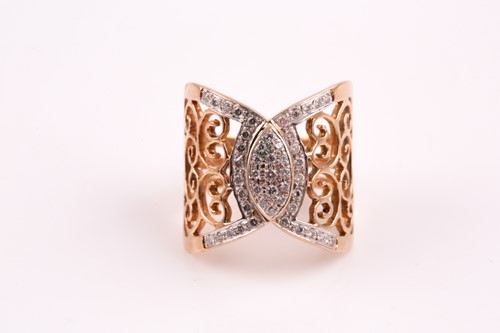 Lot 300 - A diamond dress ring; the central scroll...