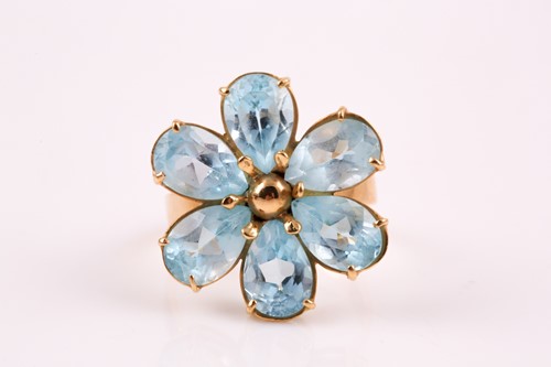 Lot 303 - A blue topaz cluster ring, the six claw...