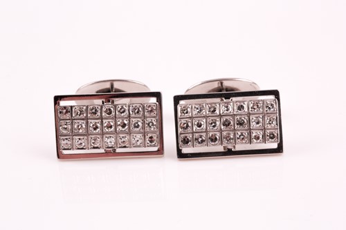 Lot 54 - A pair of diamond cluster cufflinks, the...