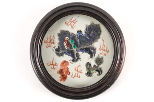 Lot 165 - A Chinese porcelain circular plaque, Qing,...