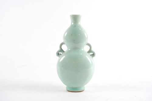 Lot 166 - A Chinese celadon gourd vase, Qing, 18th/19th...