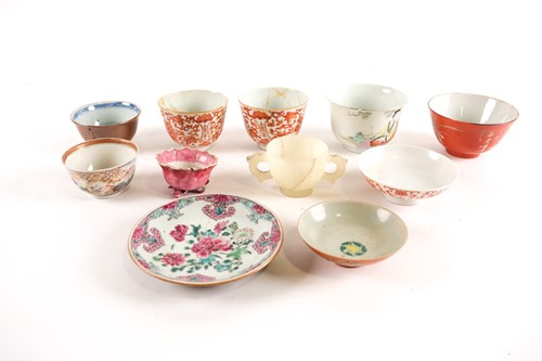 Lot 174 - A Chinese reverse decorated coral ground bowl,...