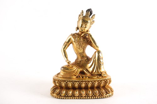 Lot 179 - A Sino Tibetan gilt-bronze figure of Tara...