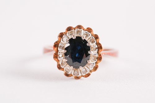 Lot 103 - An 18ct yellow gold, sapphire, and white stone...