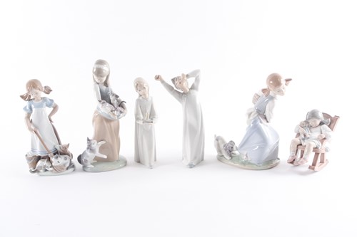 Lot 340 - A Lladro porcelain figure of a lady with a cat...