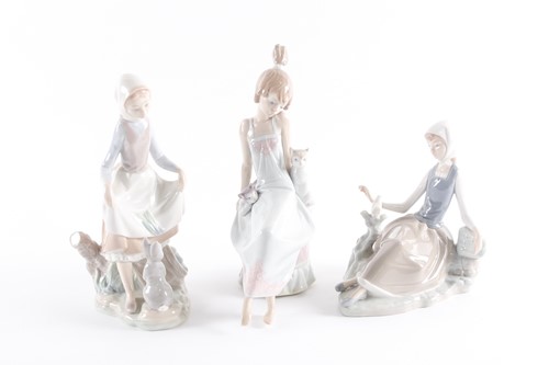 Lot 341 - A Lladro porcelain figure of a farm girl...