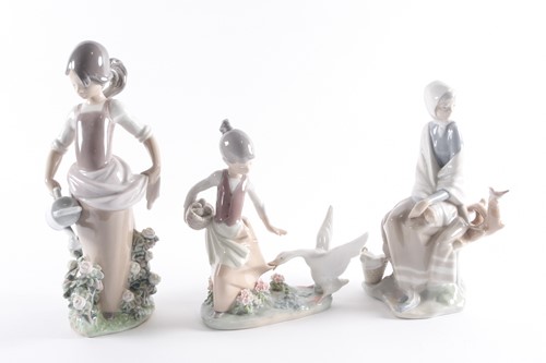 Lot 342 - A Lladro porcelain figure of a farm girl...