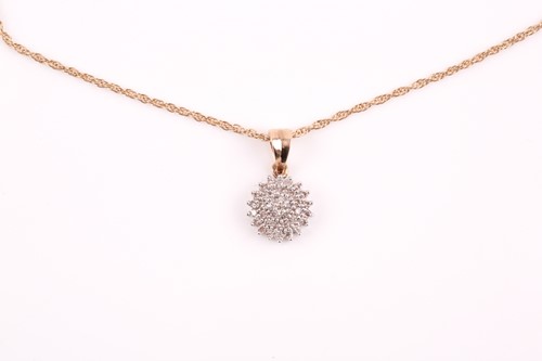 Lot 283 - A 9ct yellow gold and diamond cluster pendant,...