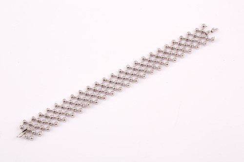 Lot 208 - An 18ct white gold and diamond lattice...