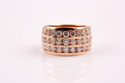 Lot 245 - A three row half hoop diamond ring; the three...