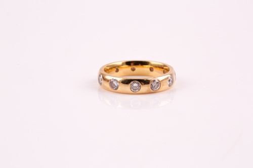 Lot 357 - An 18ct gold and diamond full hoop ring, the...