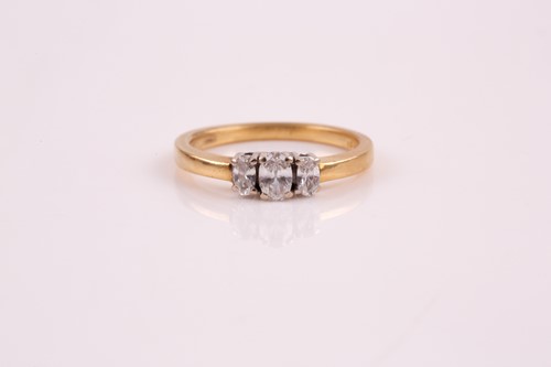 Lot 243 - A three stone half hoop diamond ring, the...