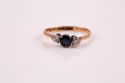 Lot 107 - A three stone half hoop sapphire and diamond...