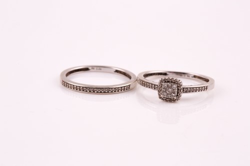 Lot 152 - A diamond cluster ring, the central cushion...