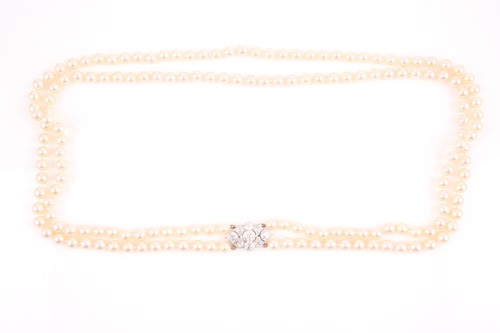 Lot 109 - A double strand pearl necklace, set with a...