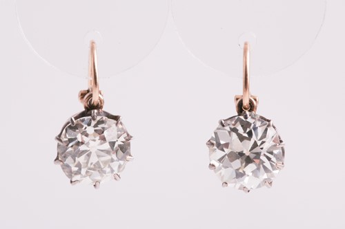 Lot 373 - A pair of Old European cut solitaire diamond...