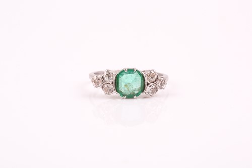 Lot 216 - A platinum, diamond, and emerald ring, set...