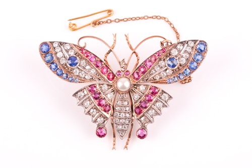 Lot 282 - A diamond, ruby, and sapphire butterfly brooch,...