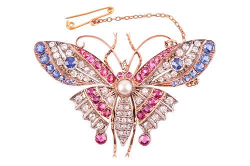 Lot 282 - A diamond, ruby, and sapphire butterfly brooch,...