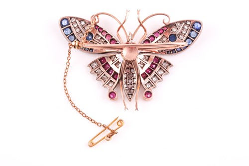 Lot 282 - A diamond, ruby, and sapphire butterfly brooch,...