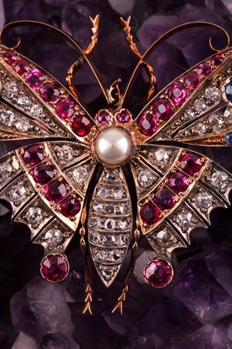 Lot 282 - A diamond, ruby, and sapphire butterfly brooch,...
