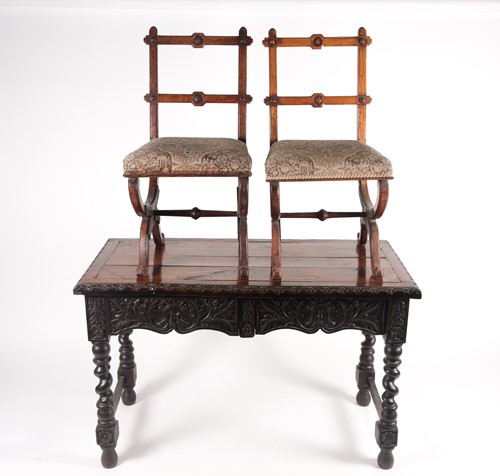 Lot 90 - A pair of Victorian x-frame golden oak 'Gothic'...