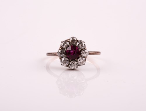 Lot 154 - A French ruby and diamond cluster ring, the...