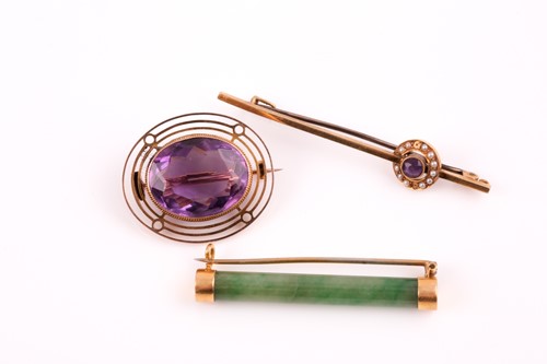 Lot 181 - A single stone amethyst brooch; the circular...