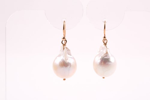 Lot 264 - A pair of yellow metal and baroque pearl drop...
