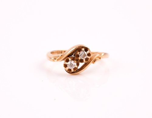 Lot 355 - A two stone diamond crossover ring, the old...