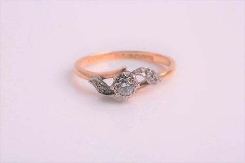 Lot 155 - A single stone diamond ring in crossover mount...