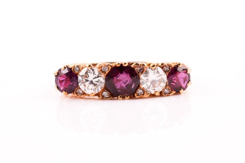 Lot 227 - A five stone half hoop ruby and diamond ring;...
