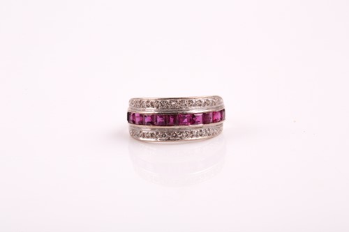 Lot 138 - An Art Deco three row half hoop ruby and...