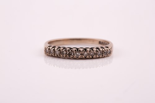 Lot 387 - An 18ct white gold and diamond half hoop...