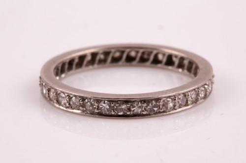 Lot 77 - A diamond eternity ring, set with round-cut...