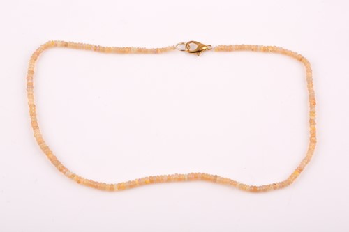 Lot 241 - An opal beaded necklace, comprising of smooth...
