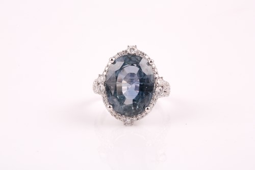 Lot 256 - A 14ct white gold, diamond, and sapphire ring,...